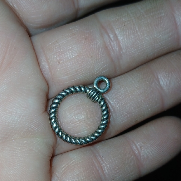 Elegant Silver-Toned Twisted Hoop Pendant
